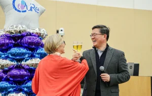 Doctors celebrate Phase 2 of the clinical study with a hooked-arm toast. 